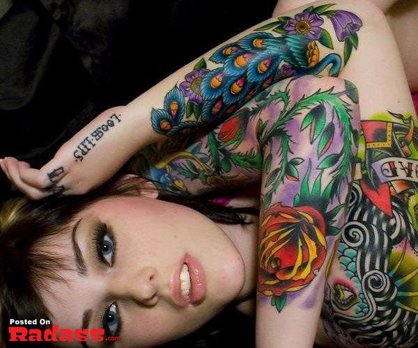 hot girls with tattoos-24 A mesmerizing tattoo adorns the back of a woman depicting two figures - a woman and a man.