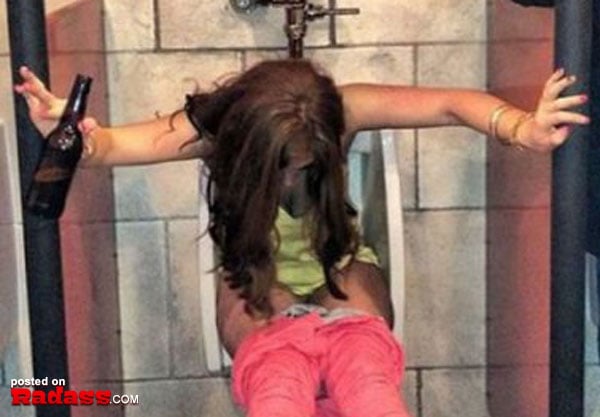 A woman is sitting on a toilet with a bottle in her hand, contemplating why she won't date you.