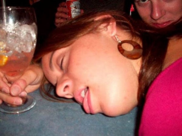 A woman with a drink in front of her, enjoying a relaxed moment. So The Girls Got A Bit Wild This Weekend (56 Pics)