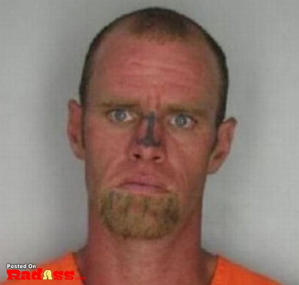 A man with a permanent facial tattoo.