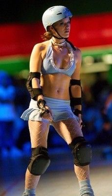 A unique female roller derby skater wearing a helmet and protective gear.