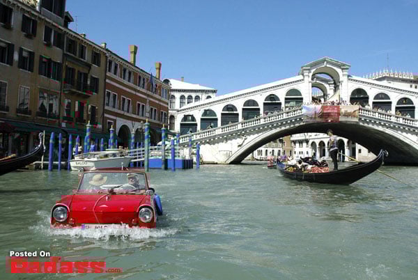 different forms of transportation-29 A snowy road traveled by a green SUV.