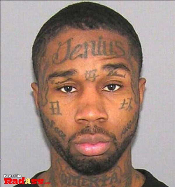 A man with face tattoos.