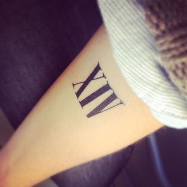 Roman numeral tattoo, forearm.