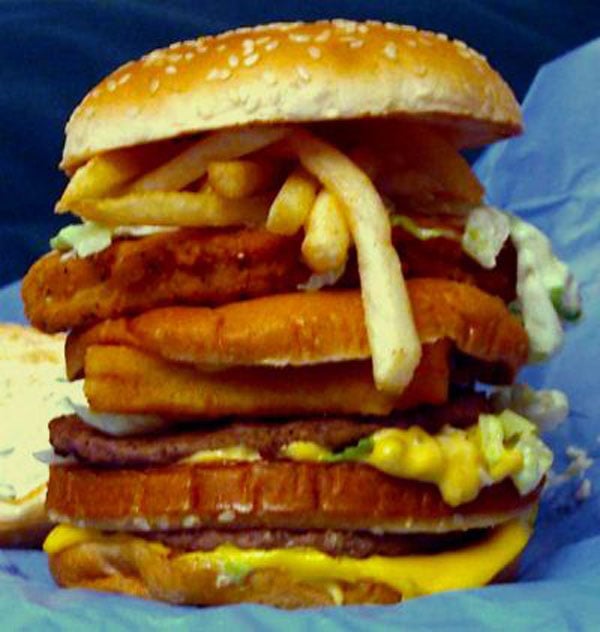 A visually stunning burger with fries atop, perfect for Super Bowl parties.