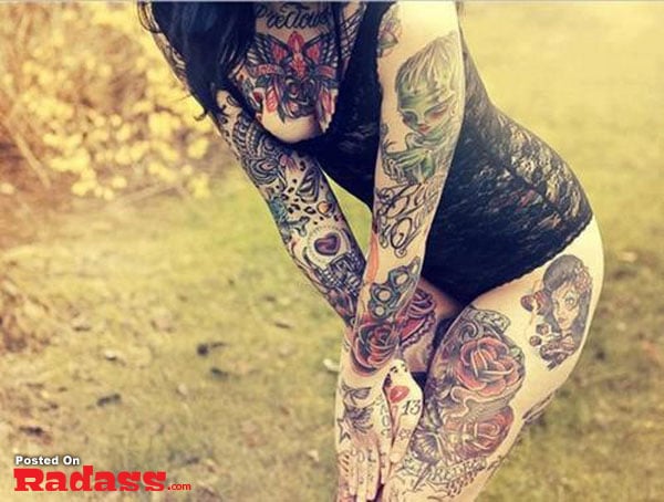 hot girls with tattoos-18 A mesmerizing tattoo of a woman adorned with graceful roses on her forearm.