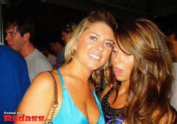 Two women posing for a picture at a party, offering a firsthand look into the widespread popularity of boobs.