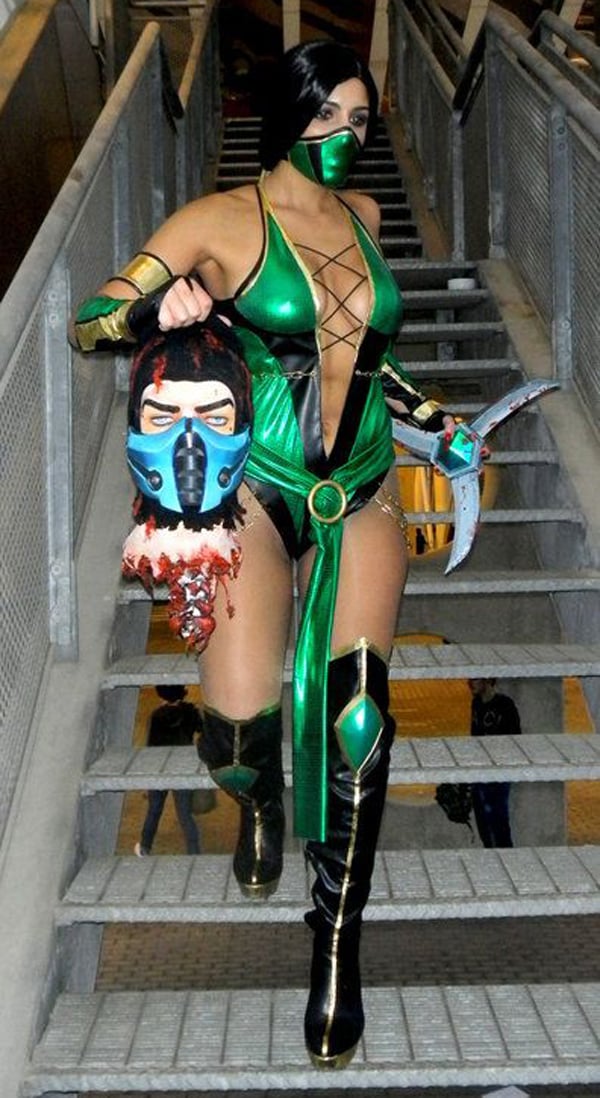 A woman in a green costume walking down stairs, always captivating with her style and grace. I Would Date You But...