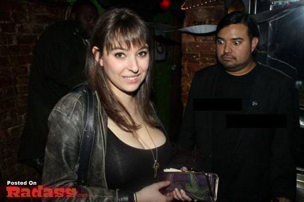 A woman standing next to a man at a nightclub, showcasing the widespread popularity of nightlife.