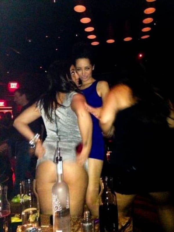 A group of women dancing at a nightclub, showcasing their fabulous moves and energy.