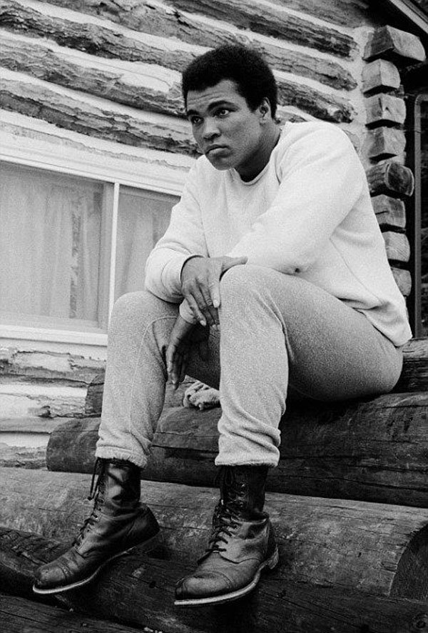 A man sitting on a log.
