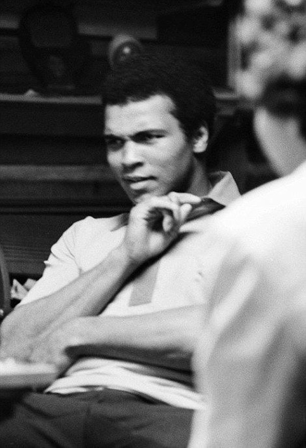 Two men conversing.