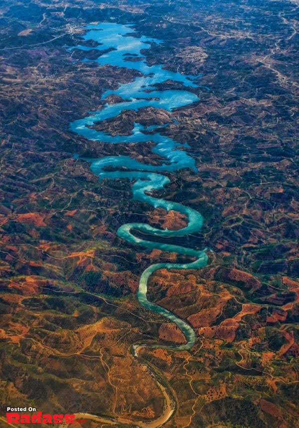 An aerial view of a river in a picturesque valley.
