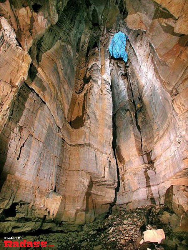 Exploring a stunning cave filled with numerous rocks.