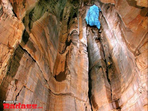 A serene canyon with a vivid blue sky.