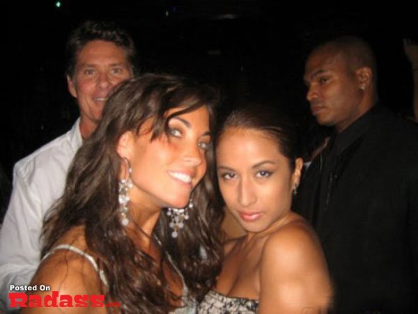 Two women posing for a picture at a party with celebrity style.