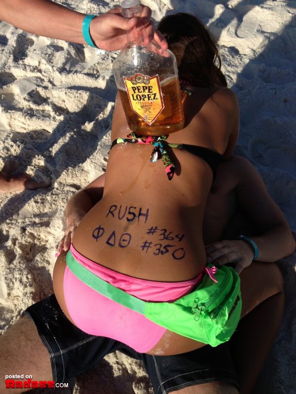 A woman in a pink bikini.
