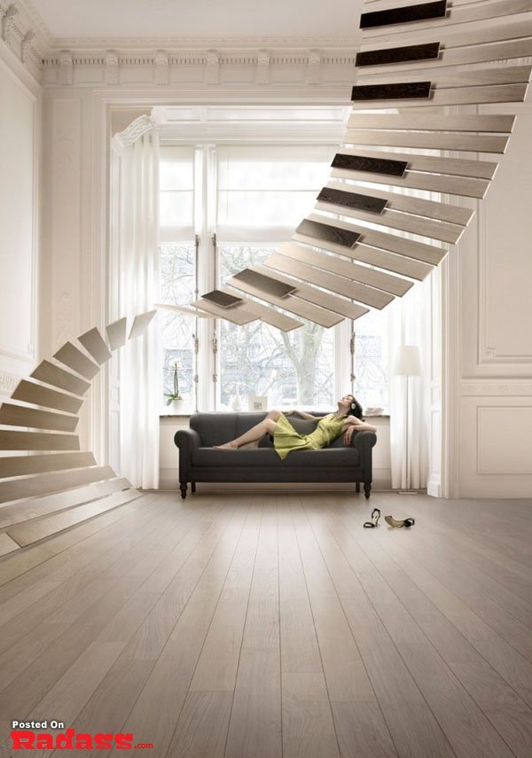 An Incredible Artist's woman model posing on a couch in a room with a staircase captured by Christophe Gilbert.