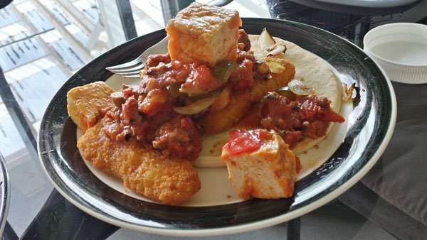 A plate of food on a table featuring 16 meals.