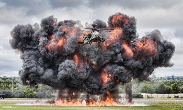 A helicopter emitting vibrant smoke for your Saturday satisfaction.