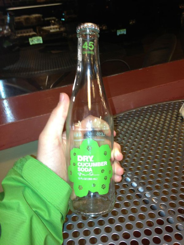 A person **holding** a bottle of water.