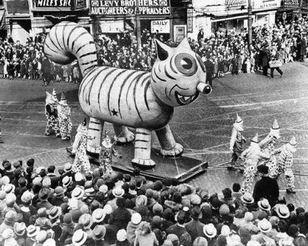An old photo of Macy's Day Parade float with a large tiger