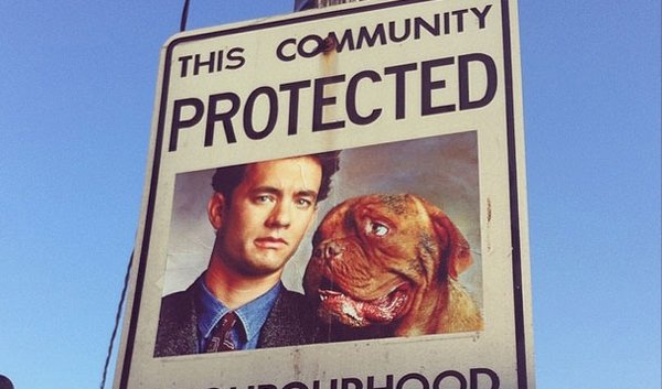 A Canadian man vandalizes a neighborhood watch sign.