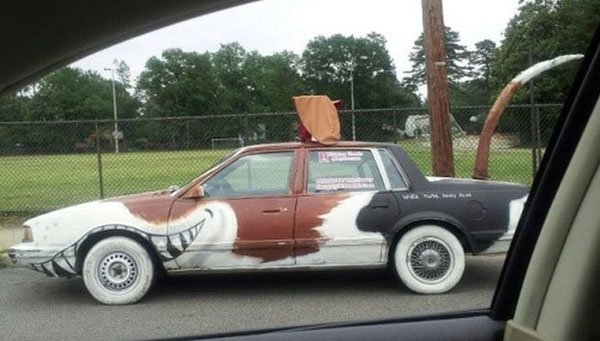 A WTF car adorned with a cat face.