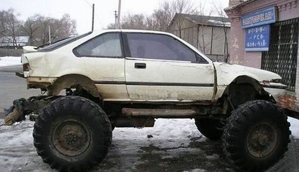 A white car parked in the snow.
