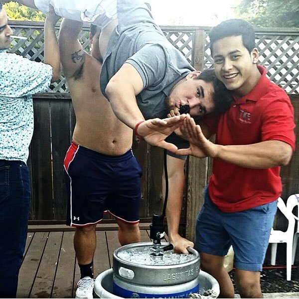 Weekend Confessions - A group of men standing on top of a keg.