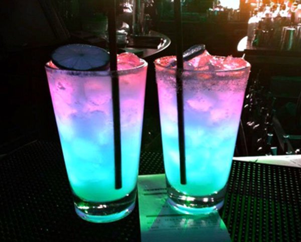 Two glasses with colorful drinks, perfect for Weekend Confessions.