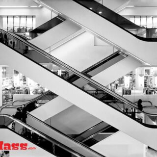 A stunning black and white photograph capturing the beauty of the architecture in a shopping mall.