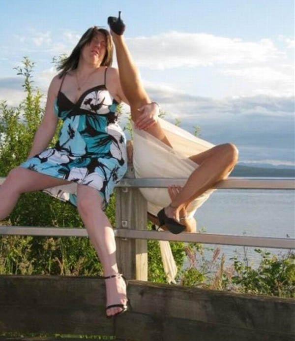 Two women I Hate It When This Happens-Face Plants on a railing near the water.