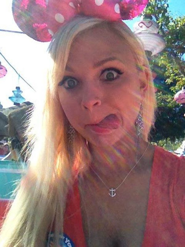 A blonde woman wearing a mickey mouse ear hat, but I Would Date You But she is already in a relationship.