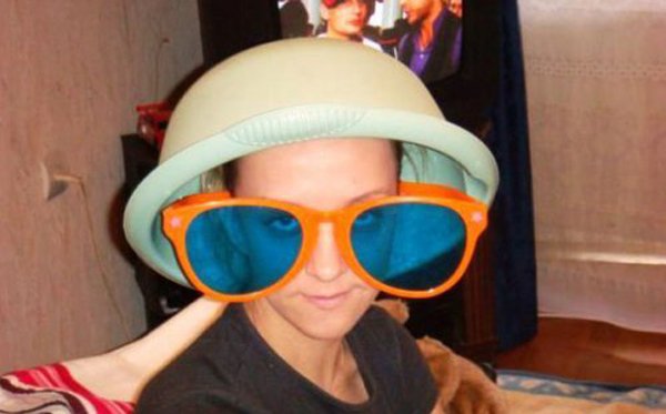 A woman wearing a blue hat.