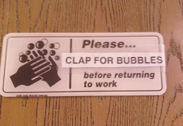 A sign that says please clap for bubbles before returning to work, designed to discourage trolls and create a positive atmosphere in the workplace.