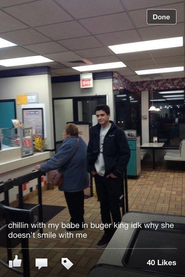 A woman is standing in front of a McDonald's restaurant, seemingly unfazed by the presence of trolls.