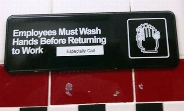 A sign indicating that employees must wash hands for sanitary purposes before resuming work.