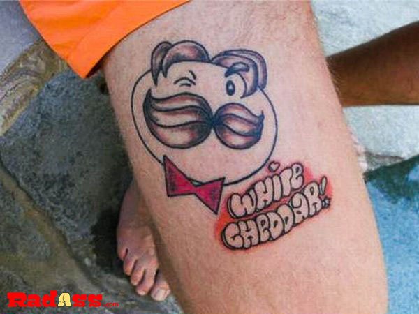 A mustachioed man with a thigh tattoo, living in the moment and showcasing unique ink.