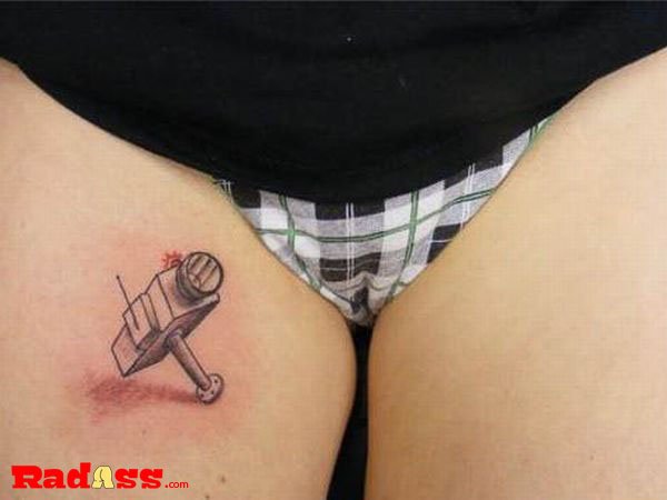 Living in the moment, a tattoo of a hammer on a woman's thigh that you would never get but love to see.
