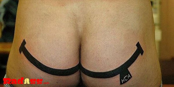 A man proudly showcases his unconventional tattoo, symbolizing living in the moment.