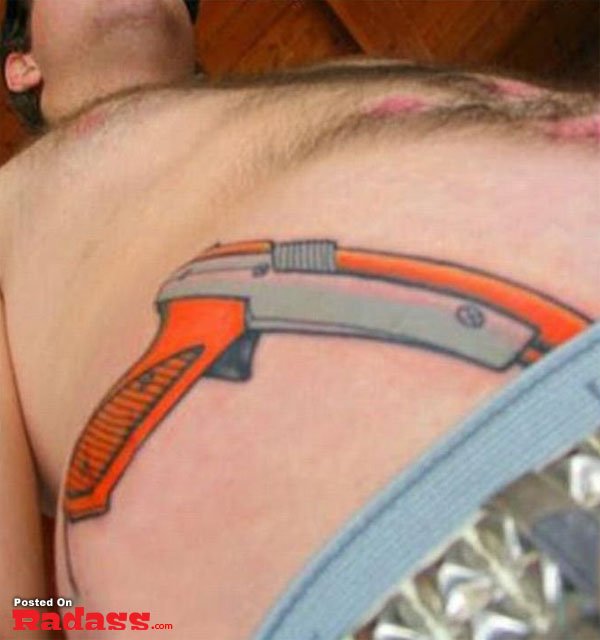 A man with a gun tattoo.