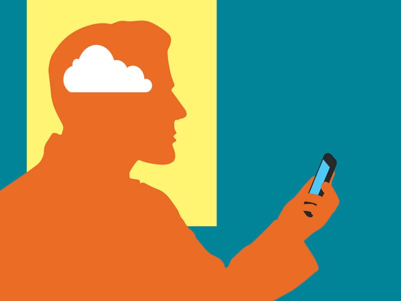 A man holding a cell phone with a cloud in his head, representing the dominance of smart devices but the ignorance of some individuals.
