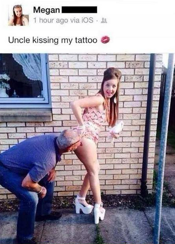 A woman is kissing her uncle while taking a selfie in front of a building.