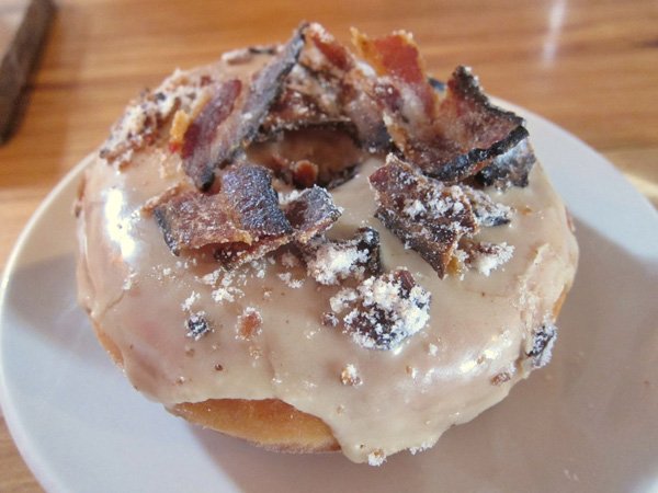 A drool-worthy plate featuring a donut for food porn enthusiasts.