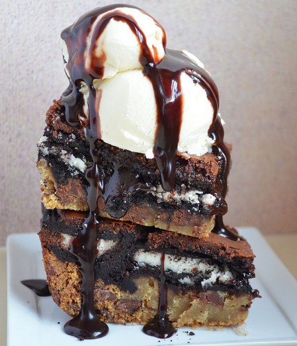 A delectable stack of chocolate cake and ice cream, perfect for satisfying your hunger and indulging in some tempting food porn.