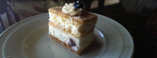 A delectable slice of cake enticingly displayed on a plate, perfect for food porn enthusiasts.