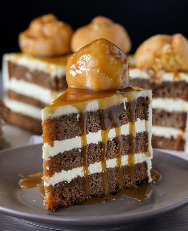 A delectable slice of cake with luscious caramel sauce on a plate, perfect for food porn enthusiasts or anyone feeling hungry.