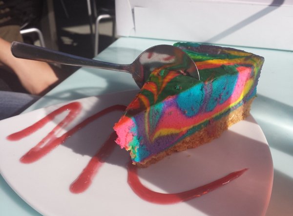 A tantalizing food porn image featuring a cake and spoon.