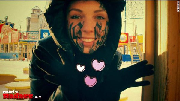 A girl in a black hoodie with tattoos you'll regret forever.